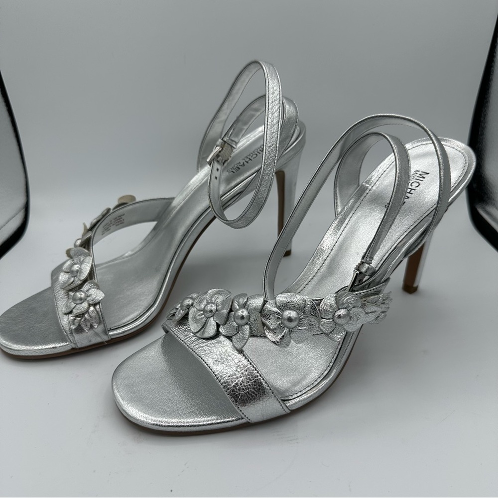 Michael Kors Women’s Metallic Silver Leather Floral Strap 4 Inch Open Toed Heel